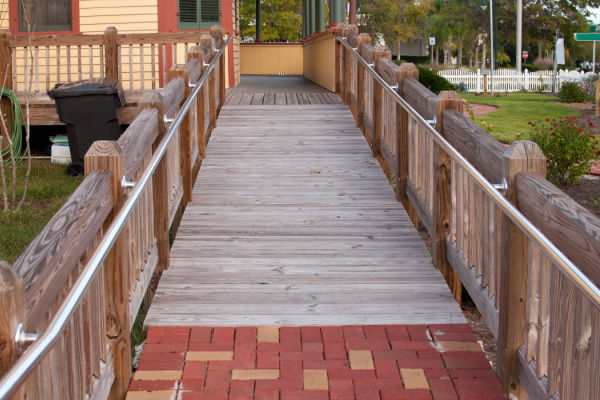 A wheelchair ramp attached to a home. 